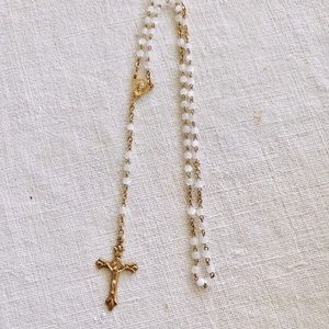 Gold Rosary with white beads in Gold Metal box with a cross on the top